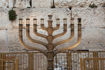 The official Hanukkah menorah of the Western Wall in Jerusalem, alight with all eight candles...
