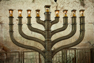 The official Hanukkah menorah of the Western Wall in Jerusalem, alight with all eight candles...