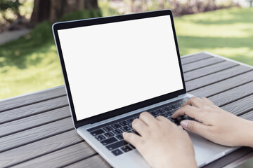 Fototapeta na wymiar Mockup blank white screen laptop computer on white top table with copy space.