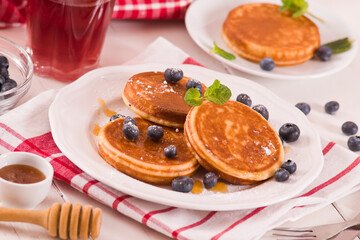 Pancakes with blueberries and chocolate cream.