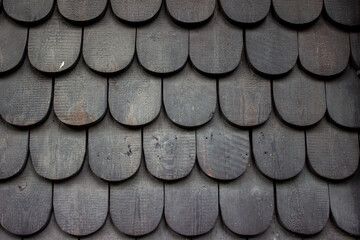 Close up layered half round green wood building