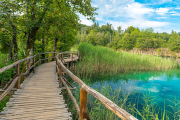 A wood quarry leads across a lake in the Plitvice Lakes National Park.