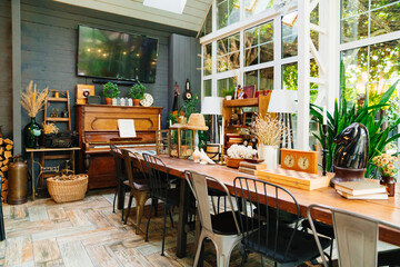 large wooden dining table with retro decor items. collecting antiques.