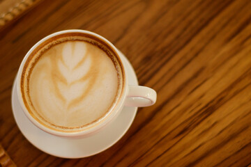 hot coffee latte Placed on a chopping board at a coffee shop in Chiang Mai, Thailand, on 29.92.2022.