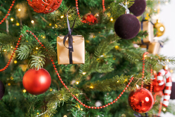 Winter decor Christmas holidays, balls and toys hanging on branches create a mood for the new year. Close-up and selective focus