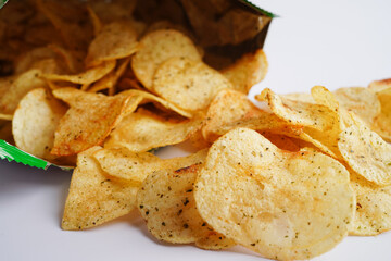 Potato chips in open bag, delicious BBQ seasoning spicy for crips, thin slice deep fried snack fast food in open bag.