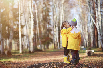 Fototapeta premium Children walk in the autumn park
