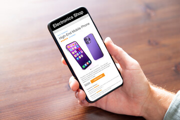 Man buying new mobile phone in online electronics shop