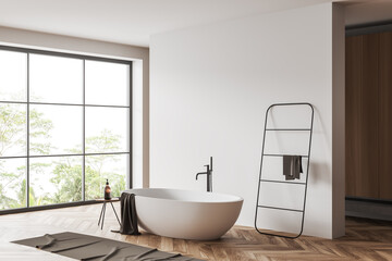 Naklejka na ściany i meble Light bathroom interior with bathtub and towel rail ladder. Mockup wall