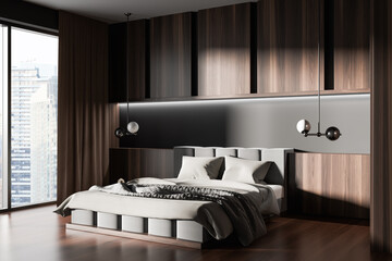 Wooden bedroom interior with bed and nightstand, panoramic window