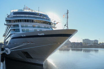 Fototapeta premium Viking cruiseship or cruise ship liner Star in port of Montreal, Canada on sunny day on St. Lawrence River for Indian summer East Coast cruising with downtown skyline and terminal