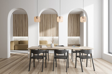 Light living room interior with dining table and soft place, panoramic window