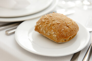 bun with seeds on the plate
