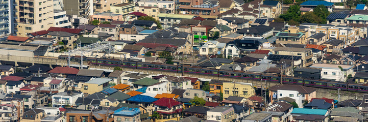 Greater Tokyo are dense buildings and houses at daytime.