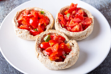 Bread baskets with cherry tomatoes. Quick, tasty and plant based appetizer.