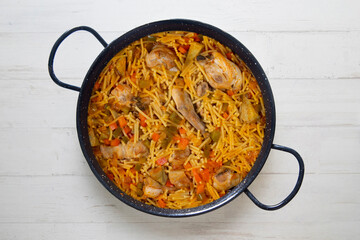 Paella with noodles, rabbit and vegetables. Tapa typical of the Spanish coast.