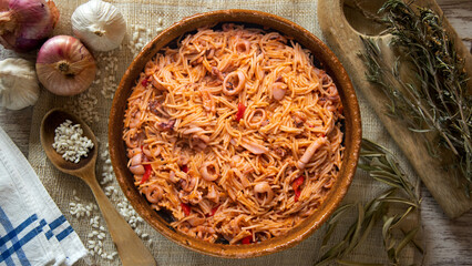 Paella with noodles, squid and seafood. Tapa typical of the Spanish coast.