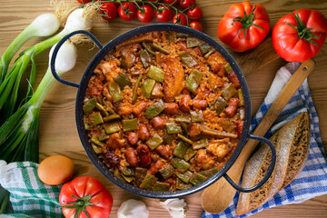 Paella with green beans and sausages. Typical Spanish paella tapa recipe with meat.