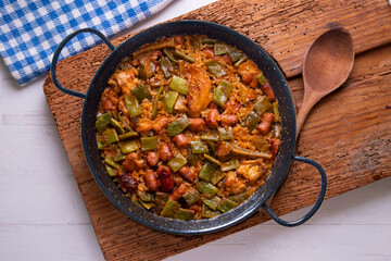 Paella with green beans and sausages. Typical Spanish paella tapa recipe with meat.