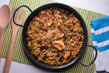 Rabbit and sausage paella. Typical Spanish paella tapa recipe with meat.