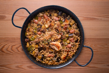 Rabbit and sausage paella. Typical Spanish paella tapa recipe with meat.