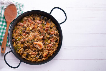 Rabbit and sausage paella. Typical Spanish paella tapa recipe with meat.