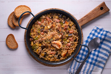 Rabbit and sausage paella. Typical Spanish paella tapa recipe with meat.