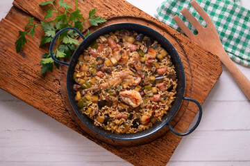 Rabbit and sausage paella. Typical Spanish paella tapa recipe with meat.