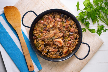 Rabbit and sausage paella. Typical Spanish paella tapa recipe with meat.