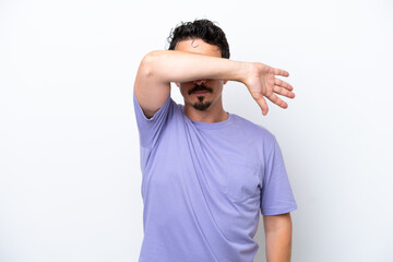 Young man with moustache isolated on white background covering eyes by hands