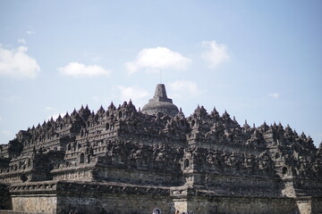 Fototapeta premium The great architecture and art at Borobudur Temple, Indonesia. This temple is the largest Buddhist temple in the world and has been inaugurated by UNESCO