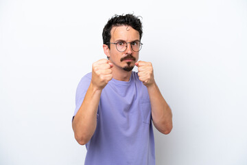 Fototapeta premium Young man with moustache isolated on white background with fighting gesture