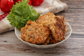 Fried salmonn cutlet in the bowl