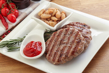 Grilled beef burger cutlet with sauce