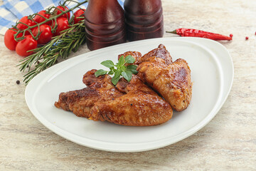 Roasted chicken wings with spicy sauce