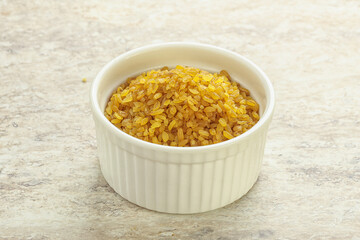 Raw bulgur in the bowl