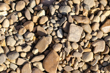 Sea pebbles lie on the shore. Rock. Decorative stones.