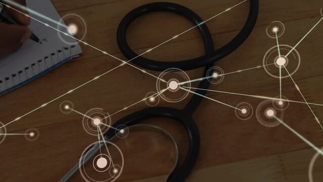 Animation of network of connections with spots over doctor's stethoscope