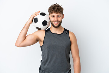 Young handsome caucasian man isolated on white background with soccer ball