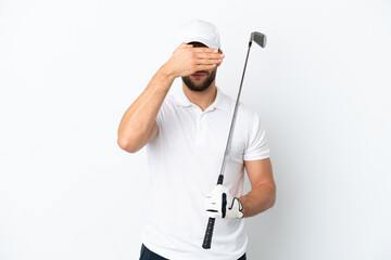 Handsome young man playing golf  isolated on white background covering eyes by hands. Do not want...