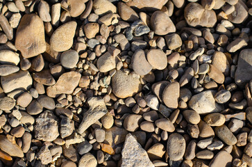 Sea pebbles lie on the shore. Rock. Decorative stones.