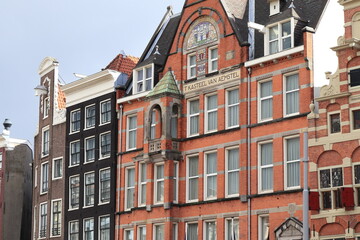 Fototapeta premium Amsterdam Nieuwezijds Voorburgwal Street Historic Brick Building Facades Close Up, Netherlands