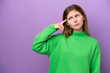 Young English woman isolated on purple background making the gesture of madness putting finger on the head