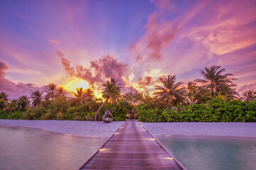 Beauty of nature concept background. Amazing beach landscape, beauty world panorama. Incredible sunset sky wooden bridge or pier. Tranquil Maldives tropical nature pattern. Paradise island shore coast