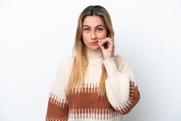 Young caucasian woman isolated on white background showing a sign of silence gesture