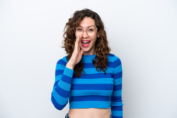 Young caucasian woman isolated on white background shouting with mouth wide open