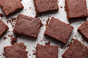 Chocolate brownies on baking paper. Sweet food