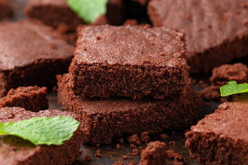 Chocolate brownies garnished with mint. Sweet food