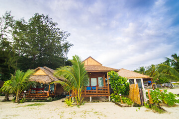 Sea beach white sand with seat bench coconut palm tree