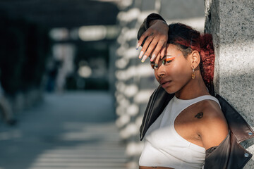 urban black girl with makeup outdoors in sun and shadow